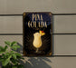 A sign for Pina Colada, featuring a glass of the tropical drink with a pineapple garnish, is displayed on a wall.