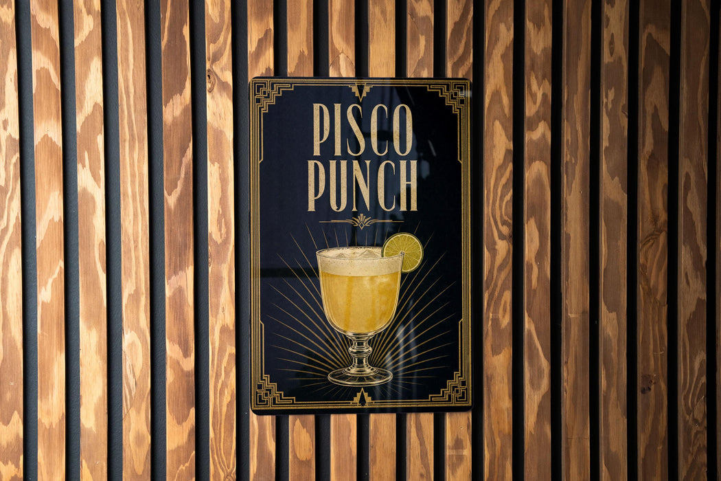 A sign for "Pisco Punch" is displayed on a wooden wall.