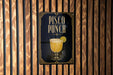 A sign for "Pisco Punch" is displayed on a wooden wall.