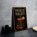 A framed poster or sign with the title "POMEGRANATE MARGARITA" and an illustration of a pomegranate and a margarita glass.