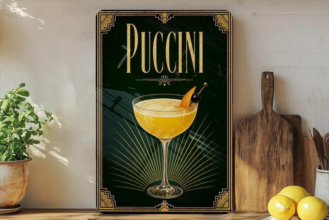 A framed poster of a yellow drink with a garnish, placed on a shelf next to a wooden cutting board and a potted plant.