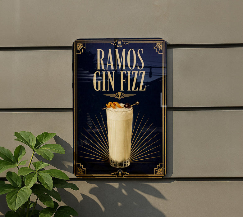 A sign for "RAMOS GIN FIZZ" is displayed on a wall, featuring an illustration of a cocktail with a straw and garnish.