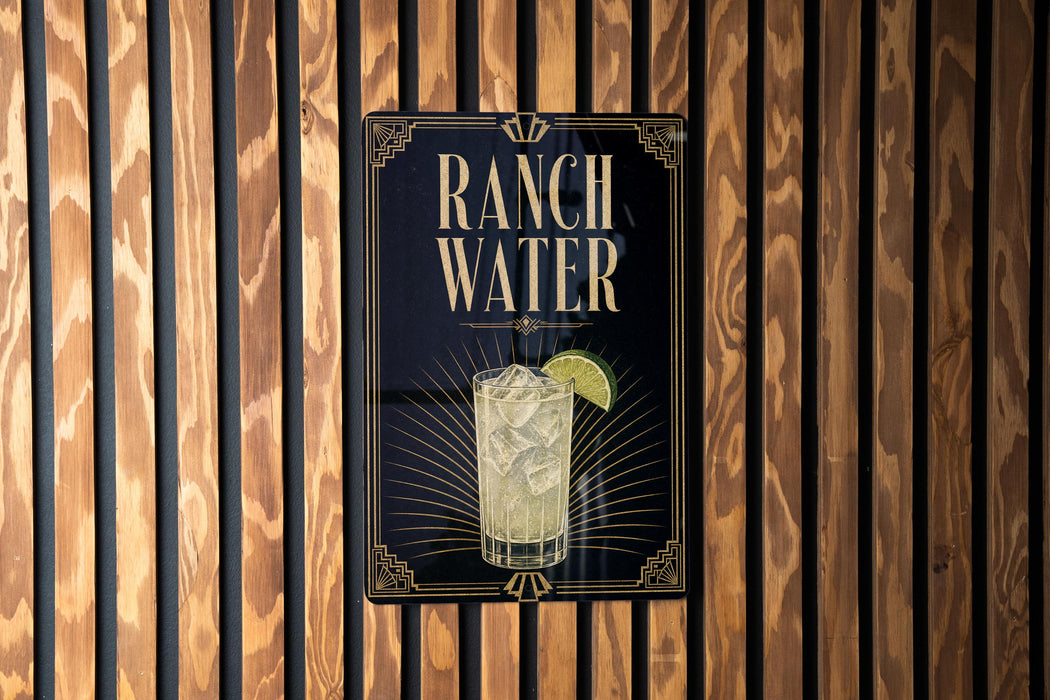 A sign for Ranch Water is displayed on a wooden wall.