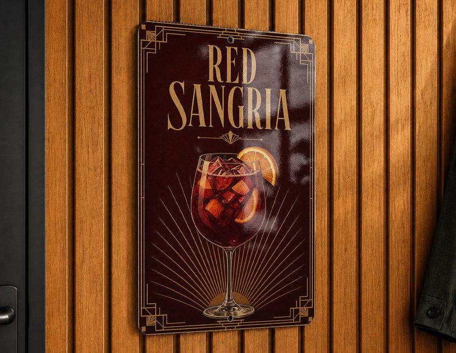A metallic sign with the text "RED SANGRIA" and an illustration of a glass of red wine with a slice of orange on a wooden background.