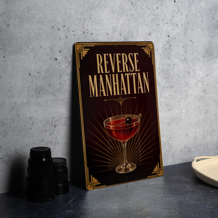 a sign with the text "Reverse Manhattan" and an illustration of a martini glass with a cherry on top.