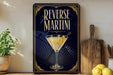 A framed poster with the text "REVERSE MARTINI" and an illustration of a martini glass with a lemon twist.