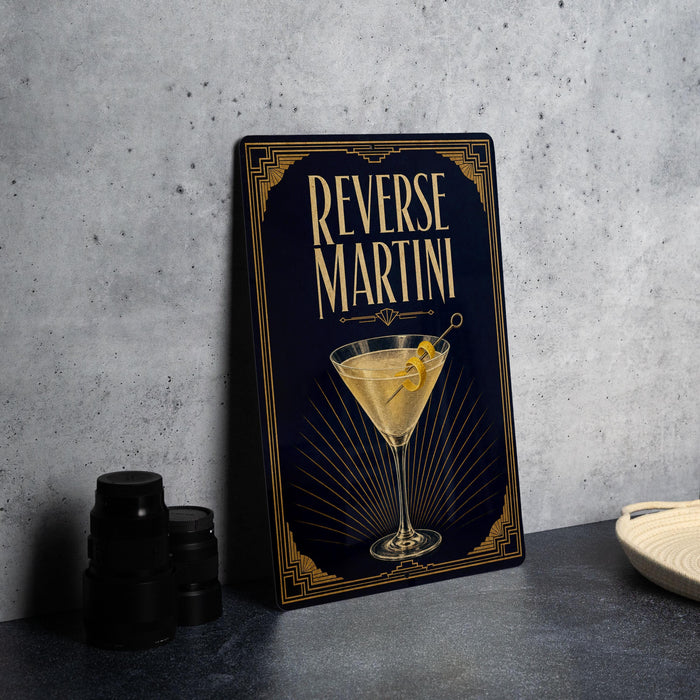 A metal sign with the text "Reverse Martini" and an illustration of a martini glass with a lemon twist.