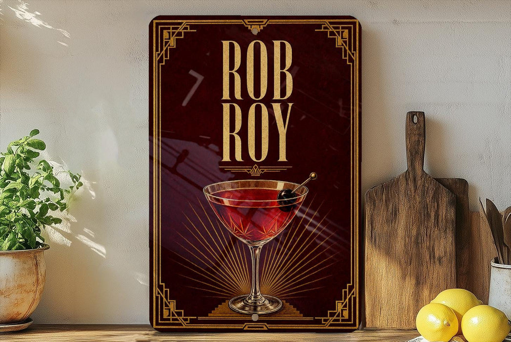 a decorative sign with the name "Rob Roy" on it, along with a martini glass and a lemon.