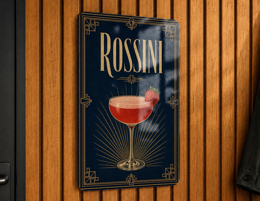 A framed poster or sign featuring a red cocktail with a strawberry garnish, hanging on a wooden wall.