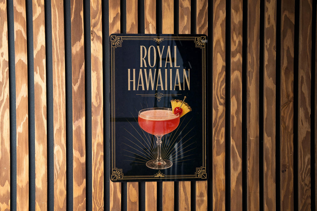 A poster advertising "Royal Hawaiian" cocktail, featuring a glass of the drink with a pineapple garnish.