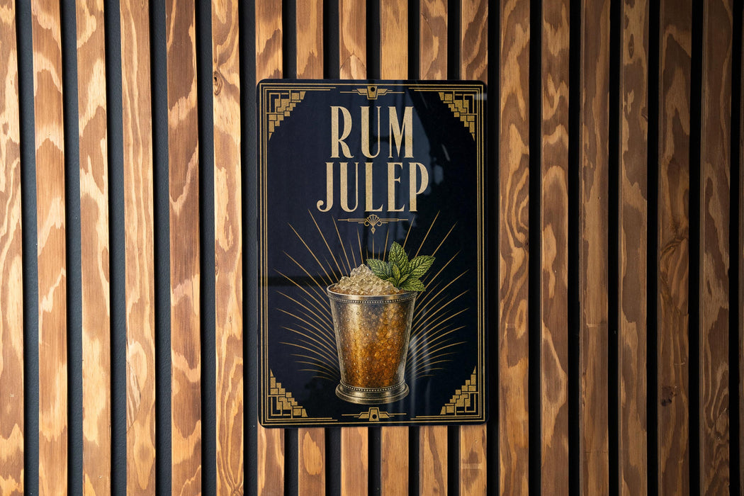 A sign for "RUM JULEP" is displayed on a wooden wall, featuring an illustration of a cocktail glass with a garnish.
