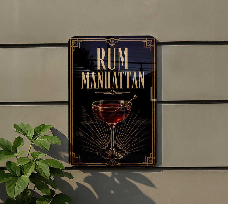 a sign for "RUM MANHATTAN" with a glass of rum and a decorative design.