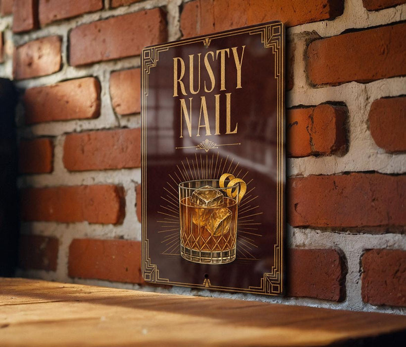 a sign with the text "RUSTY NAIL" and an illustration of a cocktail glass with a cocktail garnish.