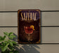 a decorative sign for "Sazerac" hanging on a wall, with a glass of red wine and a lemon peel displayed on the sign.