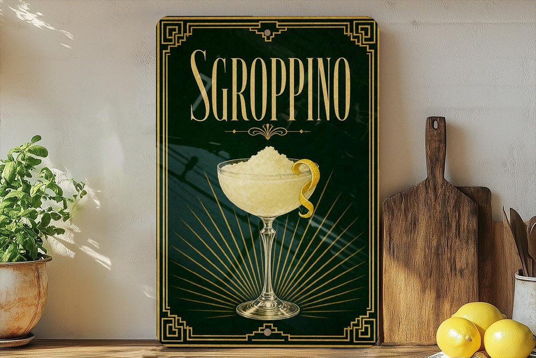 A framed poster of a cocktail glass with a lemon twist, placed on a shelf next to a wooden cutting board and a potted plant.