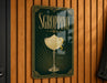 A sign for "SGROPPINO" cocktail, featuring a glass illustration and decorative elements.