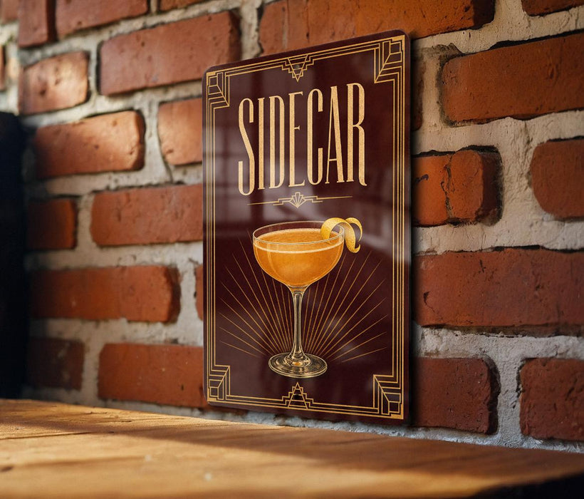 A decorative sign with the word "SIDECAR" displayed prominently, featuring an illustration of a cocktail glass with a lemon twist.