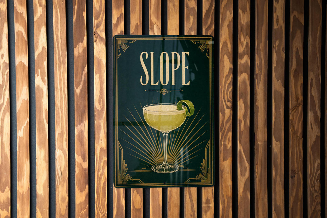 A sign for "Slope" cocktail is displayed on a wooden wall.