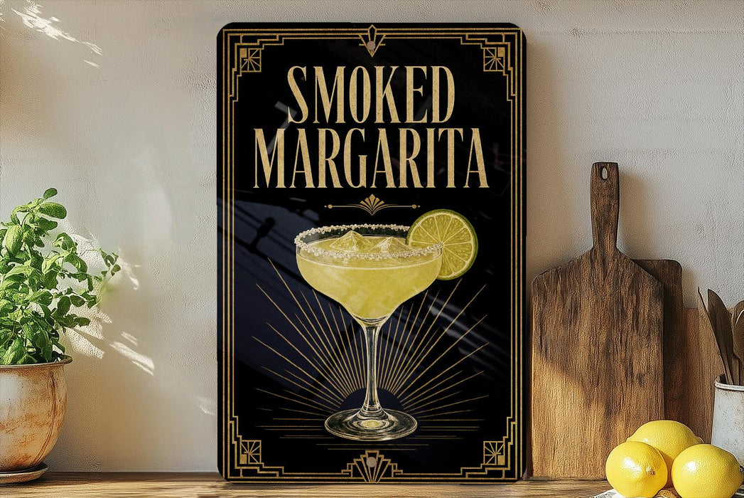 A framed poster advertising a "Smoked Margarita" is displayed on a wall, with a potted plant and wooden cutting board visible in the foreground.