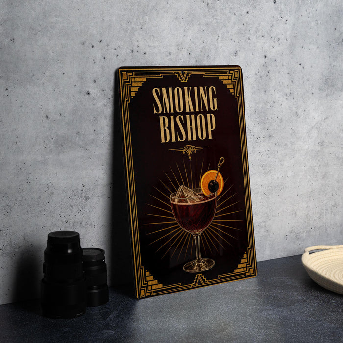 A framed poster or sign for a bar called "Smoking Bishop", featuring an illustration of a cocktail with a garnish and a decorative border.