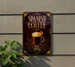 A sign for Spanish coffee is displayed on a wall, featuring an illustration of a coffee drink with whipped cream and a slice of orange.