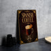 A decorative sign for Spanish coffee, featuring an illustration of a hot beverage with whipped cream and an orange slice.