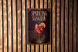 A poster advertising "Sparkling Sangria" is displayed on a wooden wall.