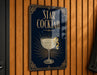 a sign for a "Star Cocktail" with a glass illustration and decorative elements.