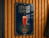 A sign for a strawberry champagne drink, featuring a glass of champagne with a strawberry garnish.