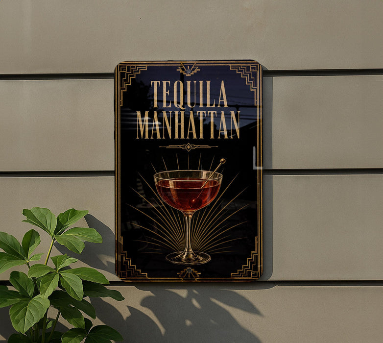 A sign for "Tequila Manhattan" is displayed on a wall, featuring an illustration of a glass of tequila with a decorative border.