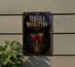 A sign for "Tequila Manhattan" is displayed on a wall, featuring an illustration of a glass of tequila with a decorative border.