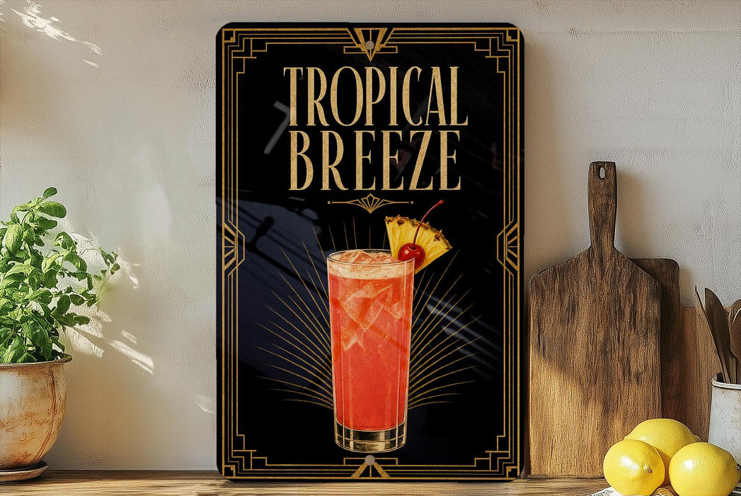 A framed poster advertising a tropical breeze cocktail, featuring a glass of the drink with a pineapple and a cherry on the rim.