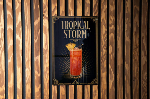 A sign for a tropical storm cocktail is displayed on a wooden wall.