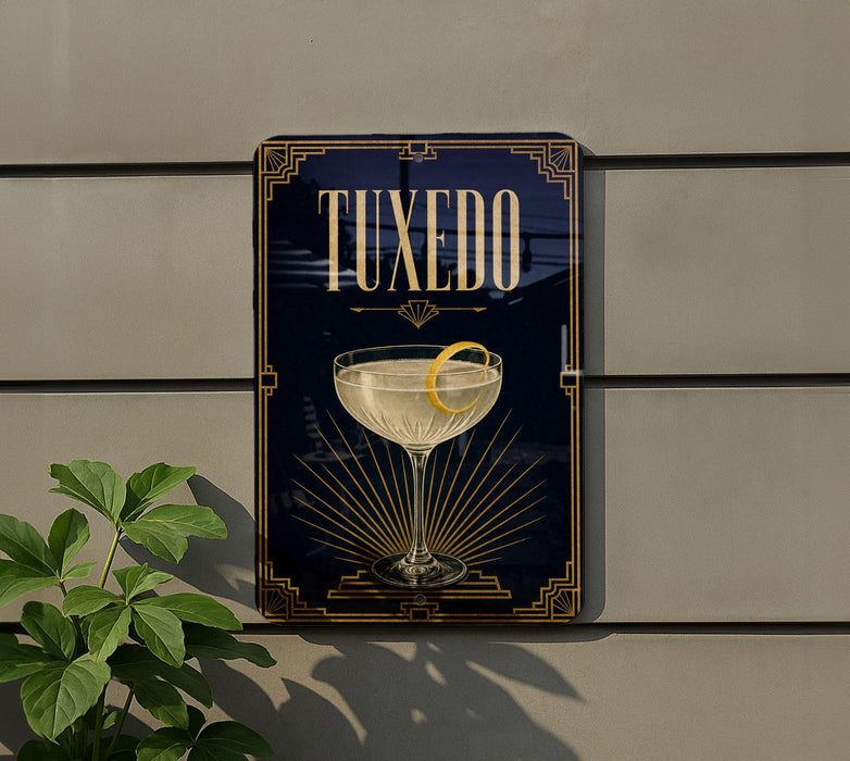 A framed image of a cocktail glass with a lemon on top, mounted on a wall.