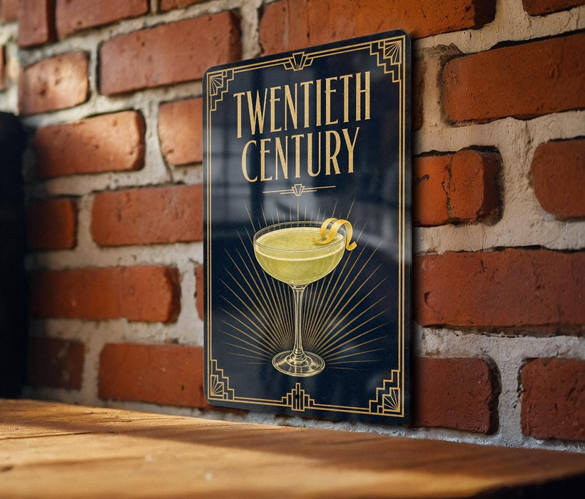 A sign with the text "TWENTIETH CENTURY" and an illustration of a cocktail glass on a brick wall.