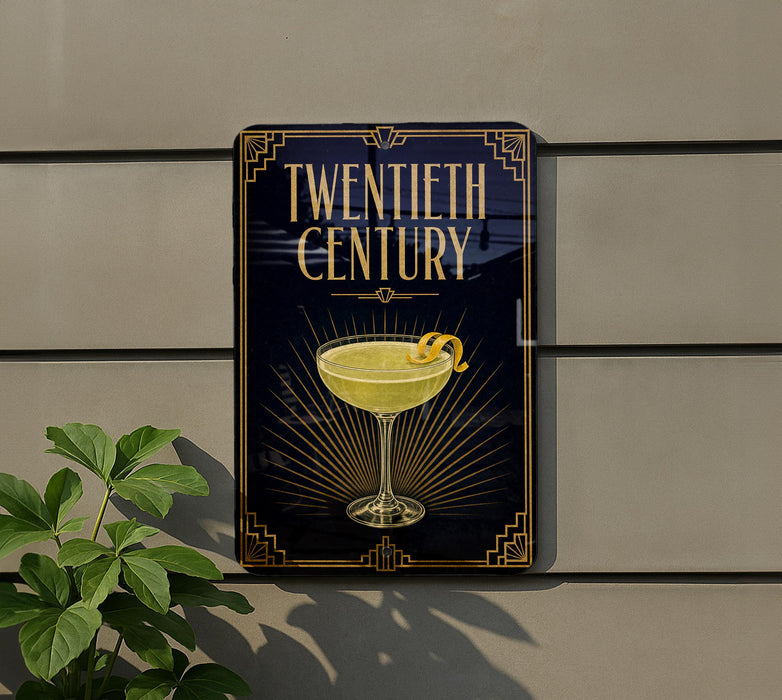 A sign for a cocktail called "Twentieth Century" is displayed on a wall, featuring an illustration of a cocktail glass with a lemon twist.