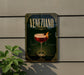 a decorative sign for "Veneziano" cocktail, with a glass of red wine and a garnish on the sign.