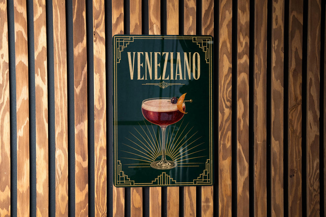A sign for Veneziano cocktail is displayed on a wooden wall.