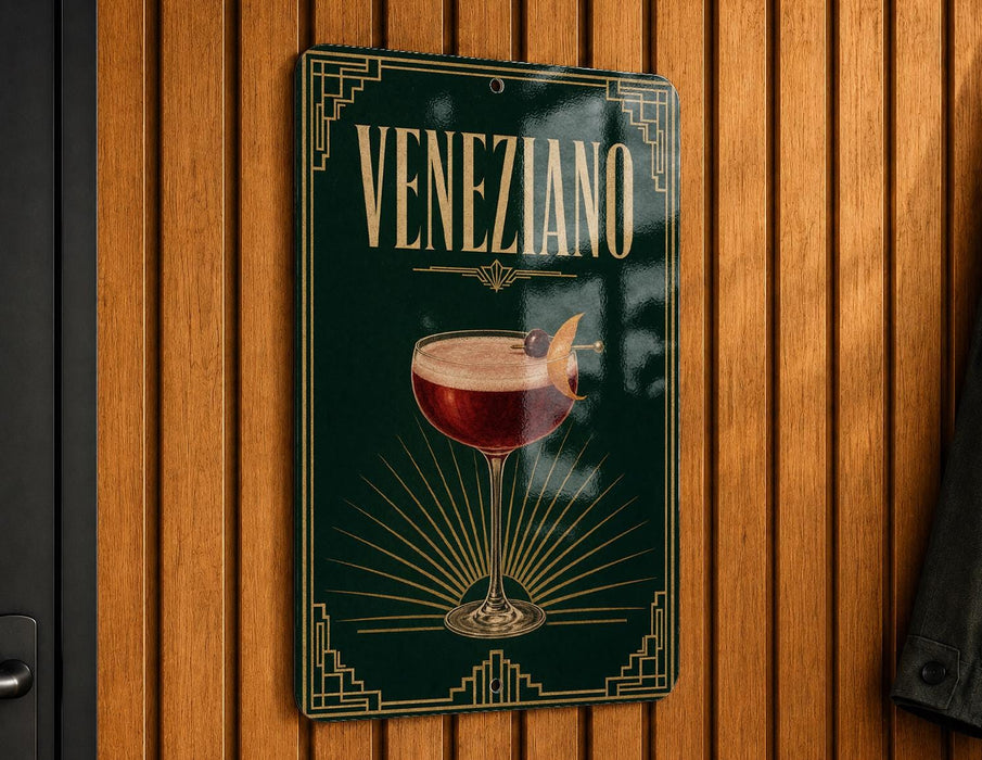 A sign with the word "Veneziano" on it, featuring an illustration of a glass of red wine with a cherry on top.