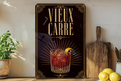 a decorative sign with the text "VIEUX CARRE" and an illustration of a cocktail glass with a lemon slice.