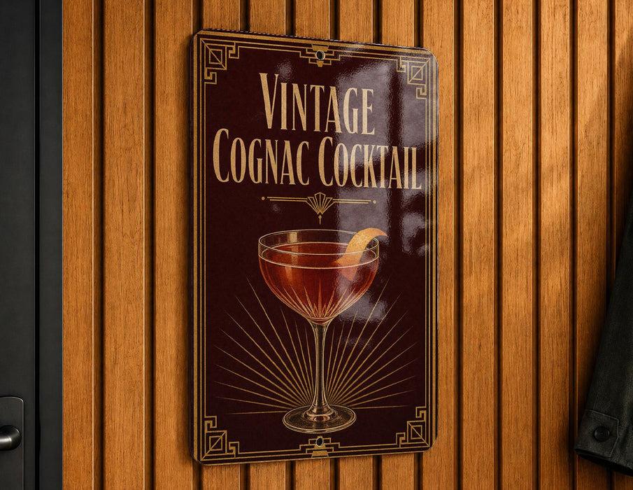 A vintage-style sign advertising a cognac cocktail is displayed on a wooden wall.