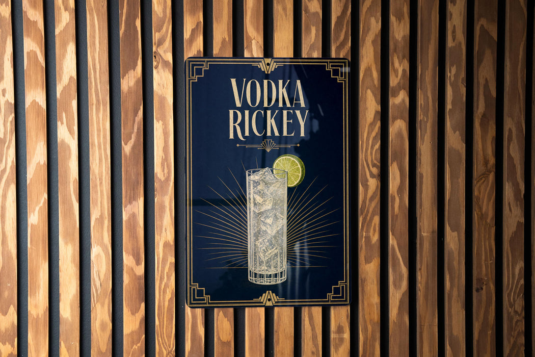 A sign for vodka richey is displayed on a wooden wall.