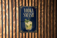 A sign for vodka smash, featuring a glass of the drink and the text "VODKA SMASH" prominently displayed.