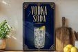 a blue sign with the text "VODKA SODA" and an illustration of a glass of vodka with ice and a lime wedge.