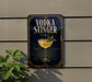 A sign for vodka stinger, featuring a glass of the cocktail and a decorative border.