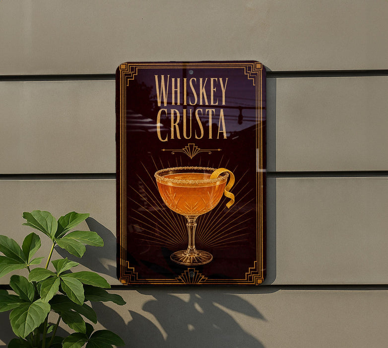 a sign that reads "Whiskey Crusta" with an illustration of a glass containing a cocktail.