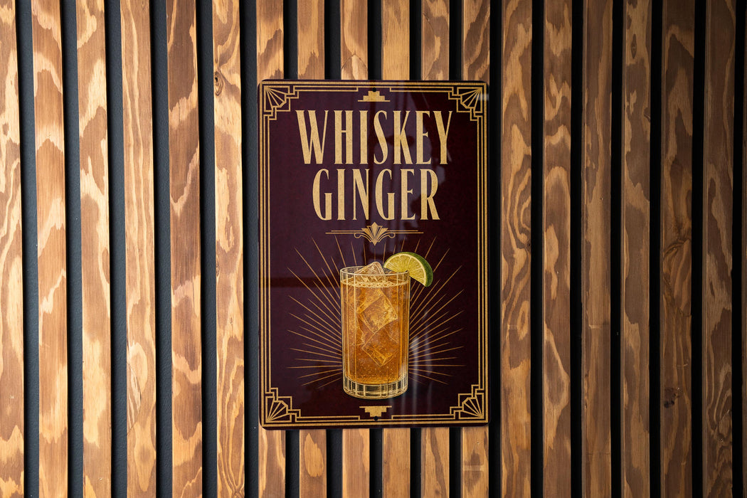 A sign for whiskey ginger cocktail is displayed on a wooden wall.