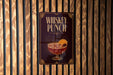 A poster advertising "Whiskey Punch" is displayed on a wooden wall.