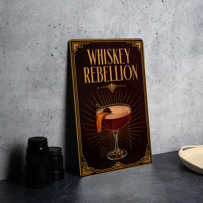 A framed poster with the title "Whiskey Rebellion" and an illustration of a cocktail on a dark background.