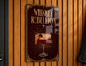 A sign that reads "Whiskey Rebellion" with an illustration of a cocktail on a wooden wall.